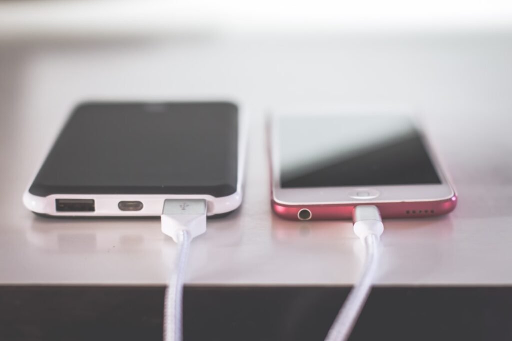 Smartphones on a table for battery drain troubleshooting